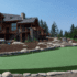 Large house with backyard putting green synthetic turf